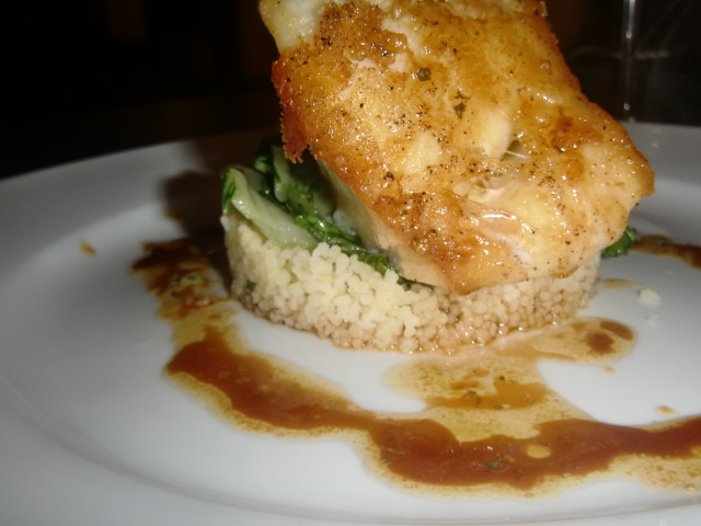 Roasted Sea Bass Over wilted Bok Choy, Couscous in a miso glaze